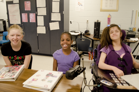 Three First Author students smile in the classroom