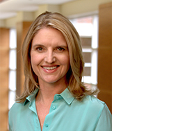 Janet Sturm, Ph.D., CCC-SLP, smiles wearing blue shirt
