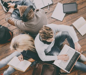 Three Students Studying using a variety of methods